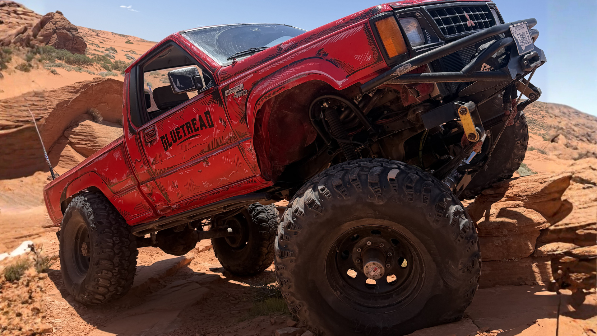 GlueTread truck driving on an off-road desert trail