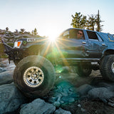 Off-road vehicle with large tires on a rocky terrain using gluetread for sidewall patch