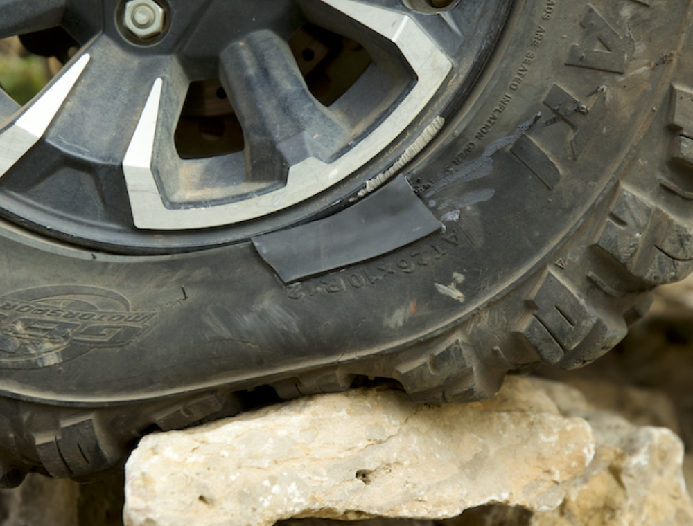 Off-road tire with a GlueTread patch on a rocky terrain