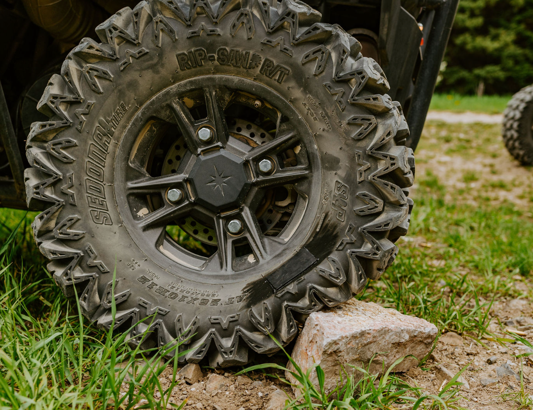 Applying GlueTread adhesive and rubber patch to tire sidewall.