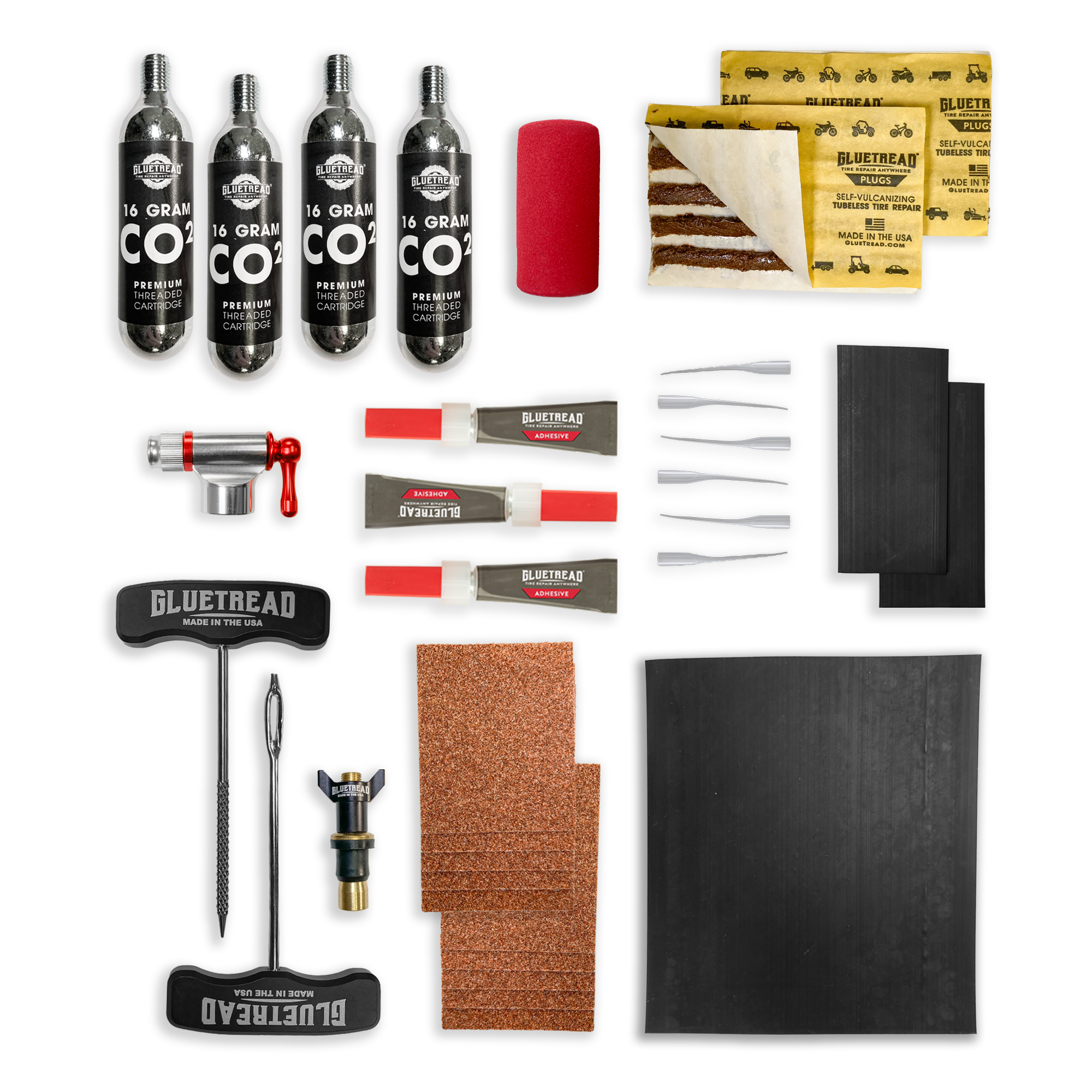 GlueTread sidewall repair kit contents including rubber patches, adhesive, sanding square, plugs, C02 and application tools