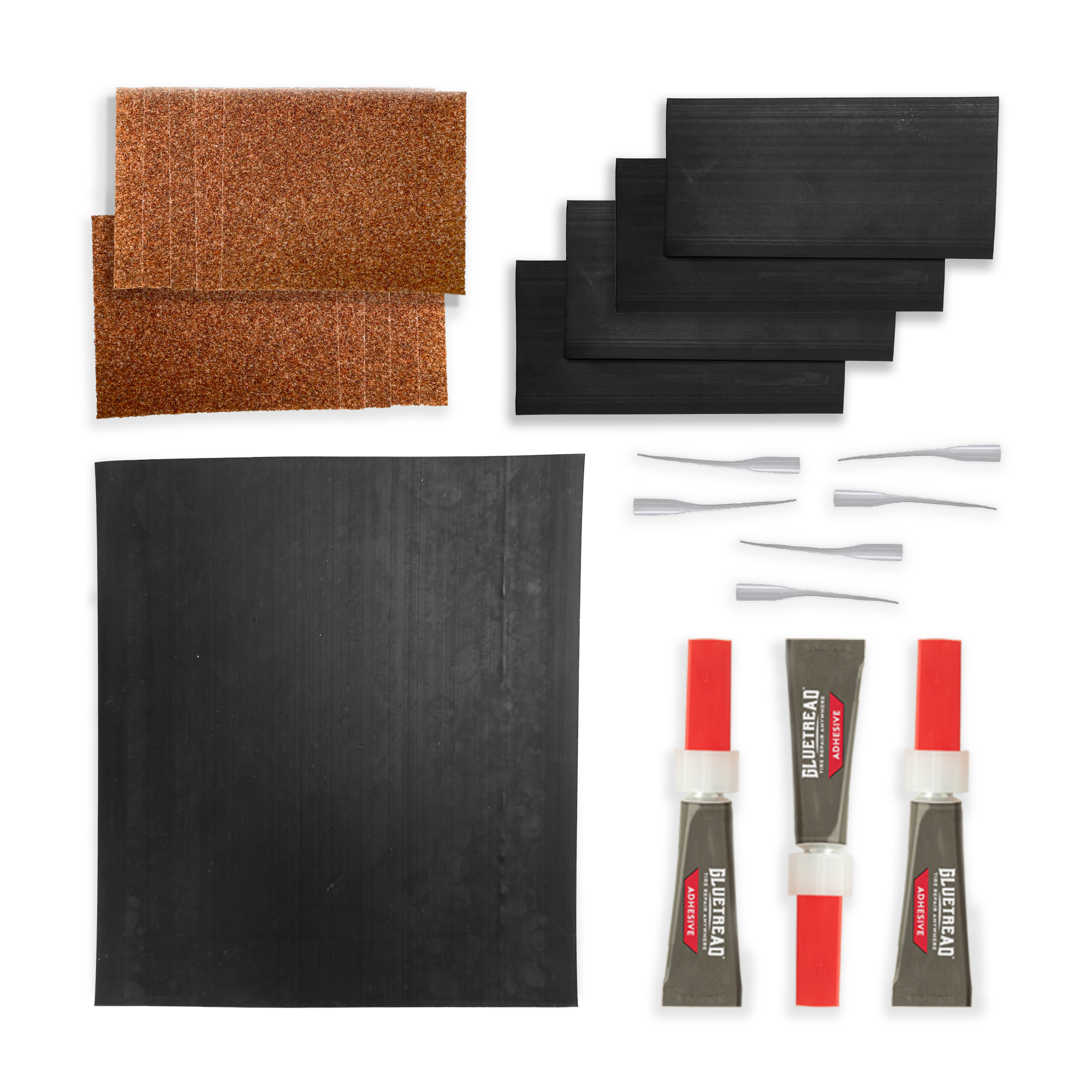 GlueTread sidewall repair kit contents including rubber patches, adhesive, sanding square, and application tools
